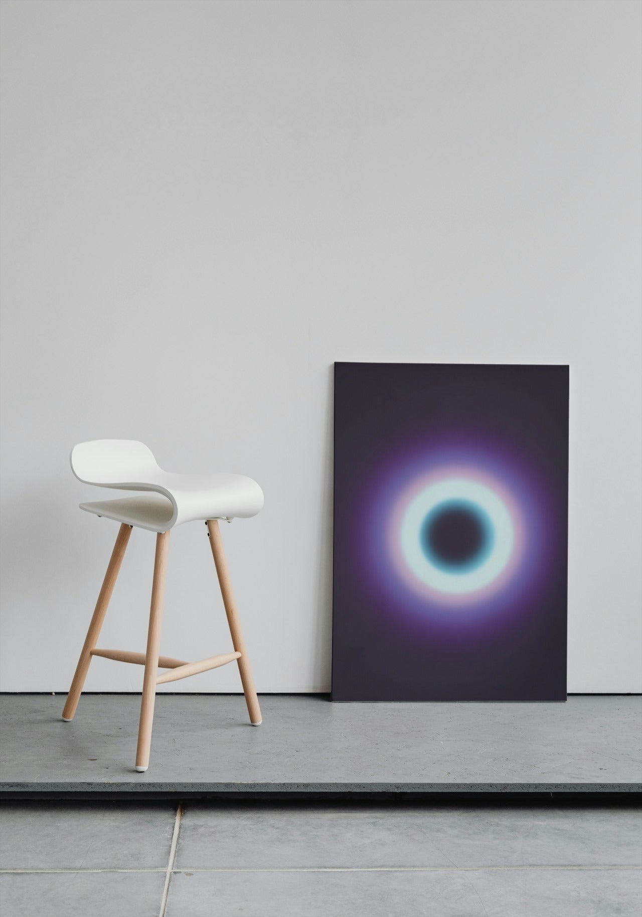 Cosmic Abyss: Illuminated Black Hole with Purple and Blue Glow